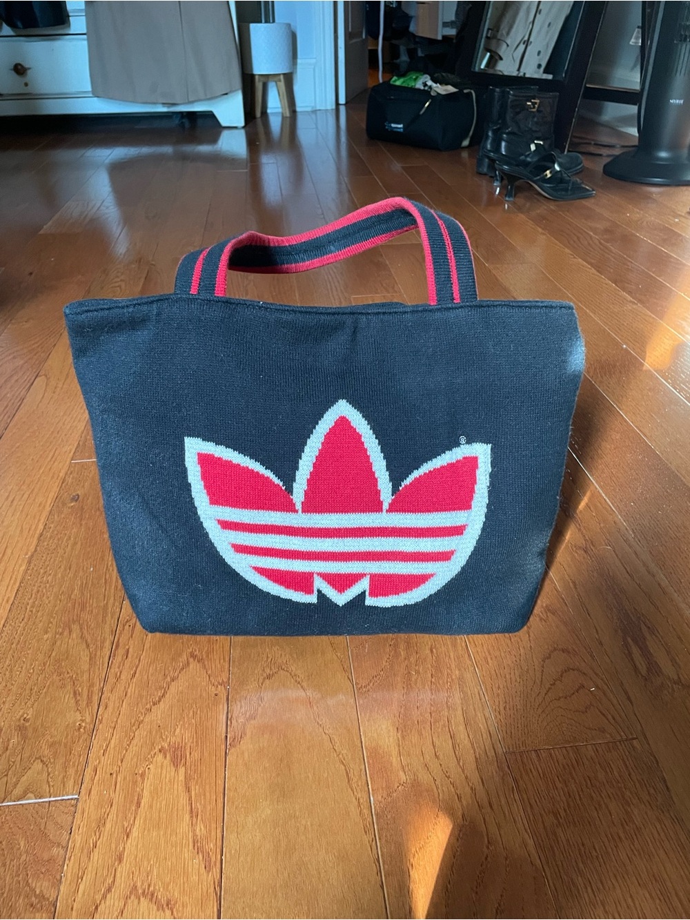 Adidas Black Knit Tote with Red Trim and Trefoil Logo.  14 inches by 9 inches